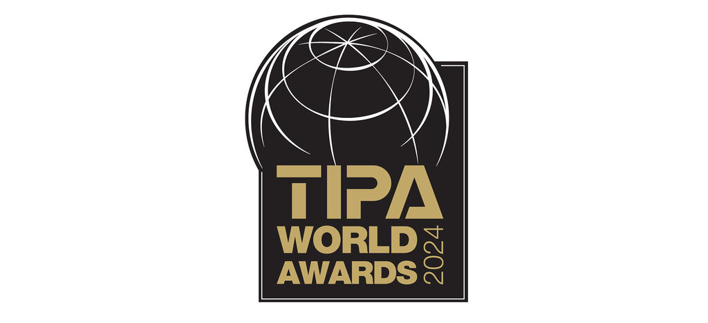 Logo for TPA World Awards 2024 med en stiliseret globus.